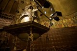Illuminating Altar: A Stunning Chandelier in a Temple Crypt