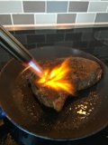 Sizzling Steak on a Flaming Pan