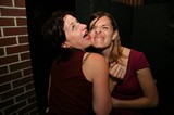 Two Friends Goofing Around at a Nightclub