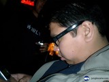 Man In Glasses Checking His Phone