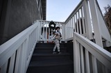 Children Embracing on Outdoor Stairway at Dusk