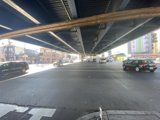 Cars Pass Underneath an Urban Overpass