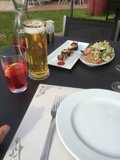 White plate with beer and cutlery