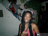 Dreadlocked Woman Enjoying Her Drink