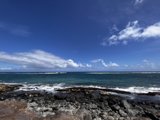 Majestic Waves Crashing Against Rocky Shoreline
