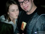 Portrait of Two People in Jackets and Glasses