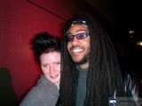 Urban Portrait with Smiling Couple and Dreadlocked Man