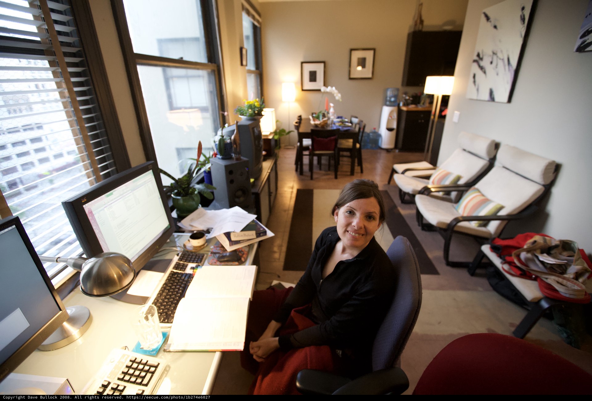 Woman Smiling at Home Office Desk Setup