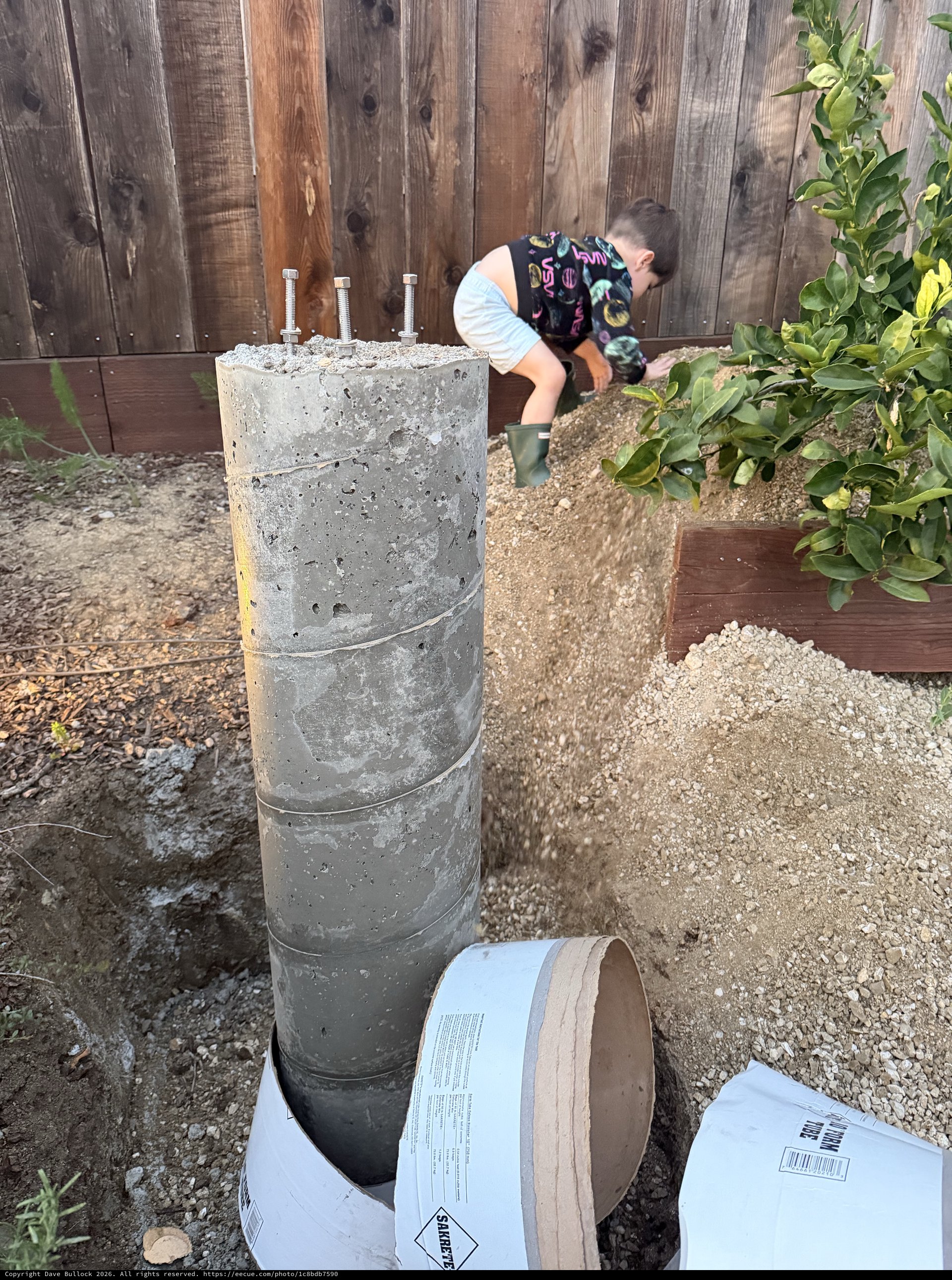 Concrete Pier Foundation with Anchor Bolts in Backyard