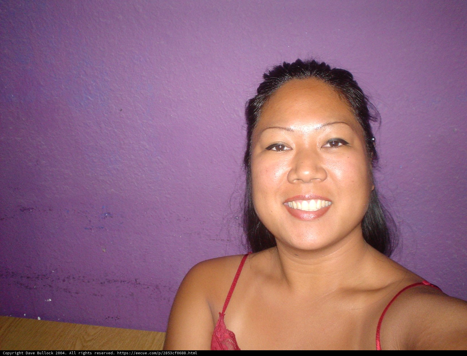 Radiant Smile before the Purple Wall