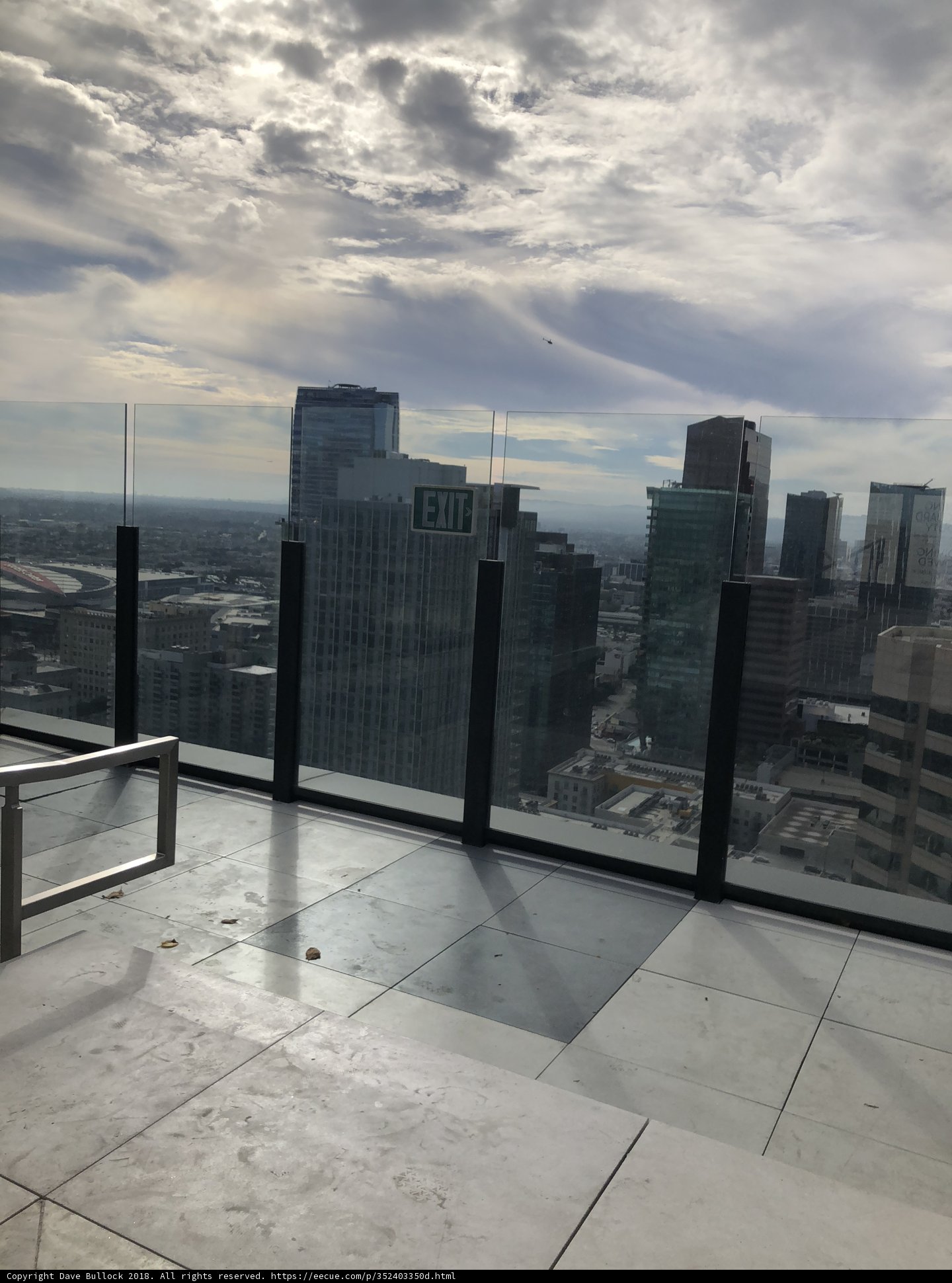 Cityscape View from Rooftop Bench