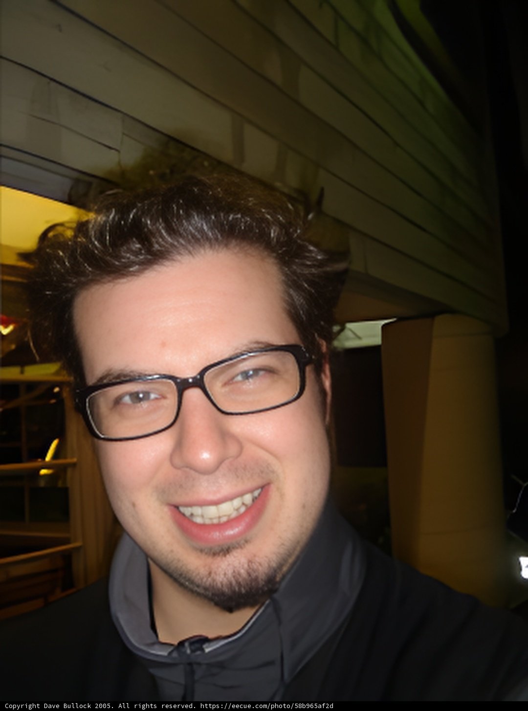 Urban Portrait of a Happy Man with Glasses