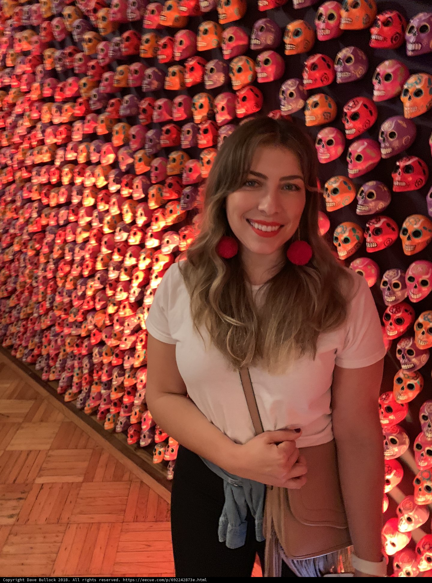 Smiling Woman Amongst Skulls