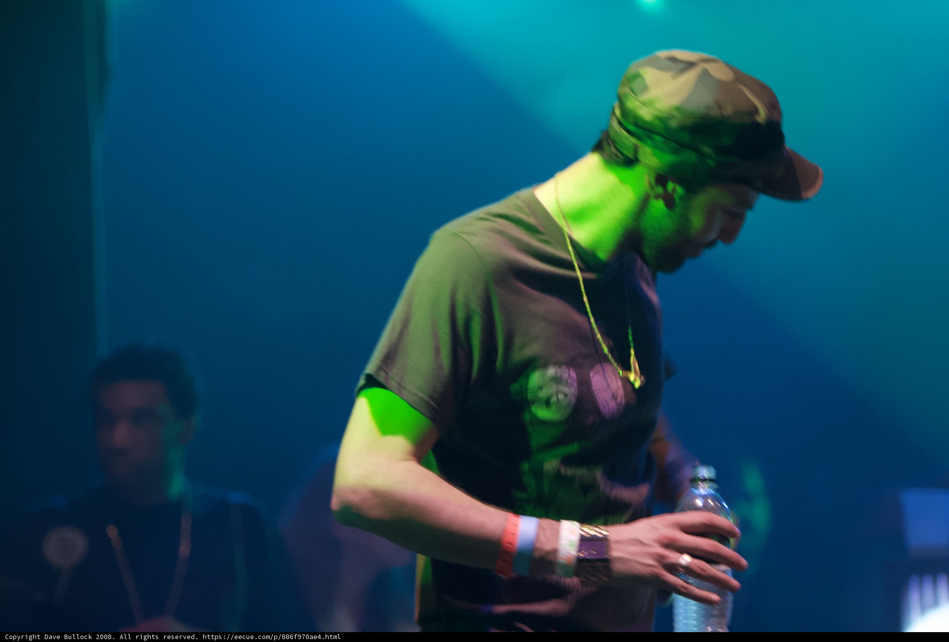 The Hat Man with a Water Bottle at the Concert