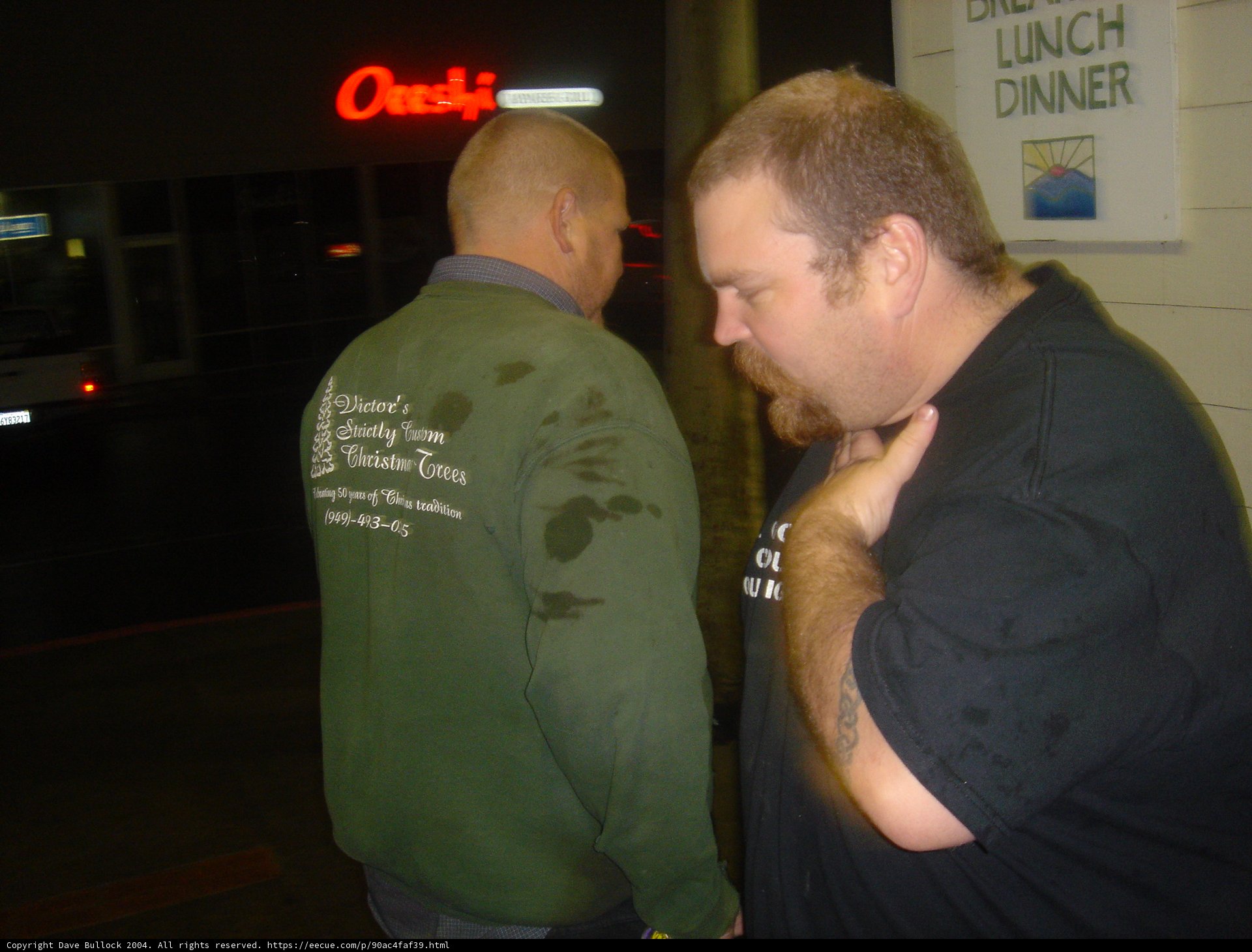 Green-Shirted Man Enjoys Drinks and Games at Urban Pub