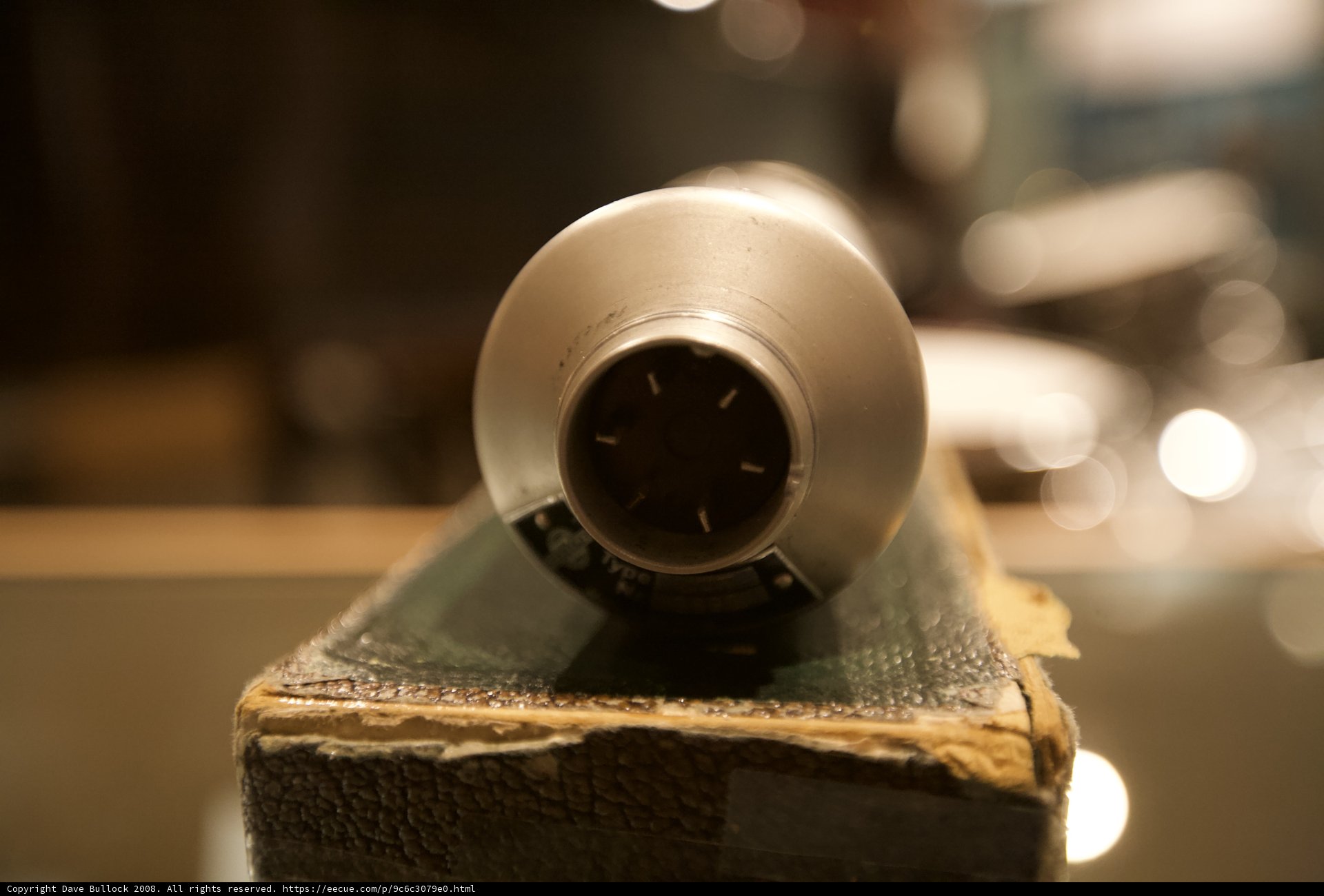 Metal Sphere on a Wooden Table