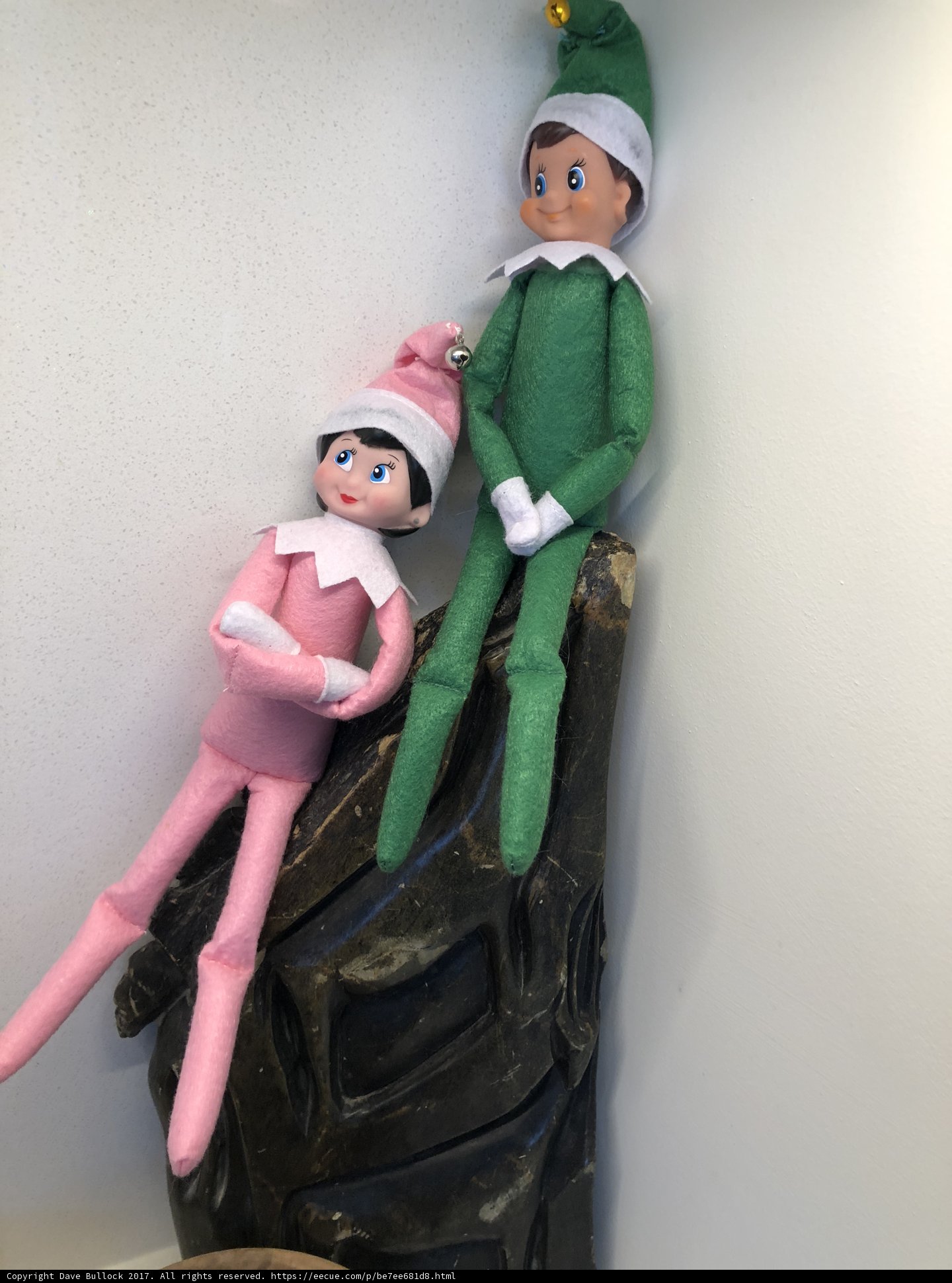 Elf Dolls Perched on a Shelf