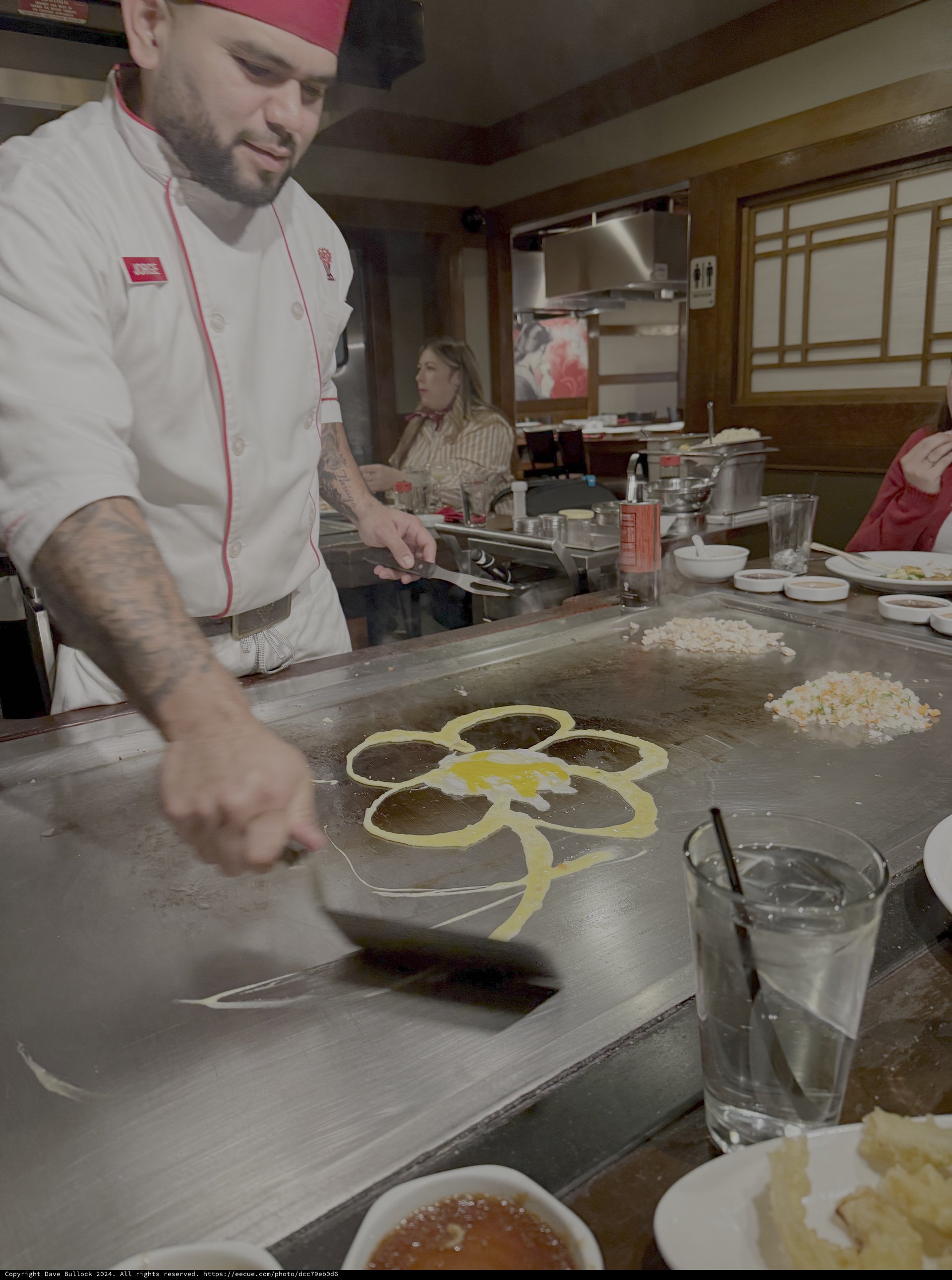 Chef Demonstrates Teppanyaki Cooking with Flower Design