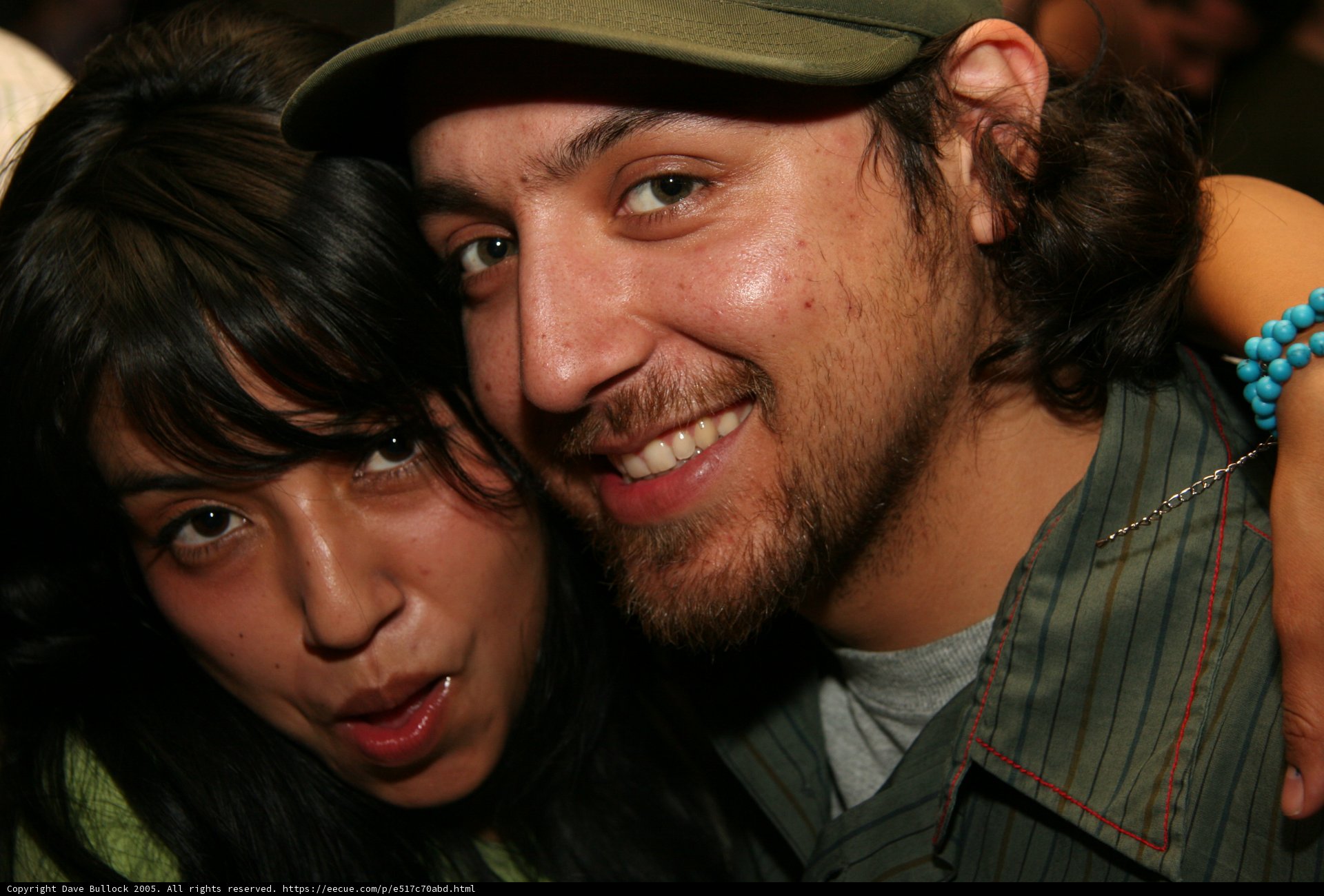 Smiling Couple in Baseball Hats