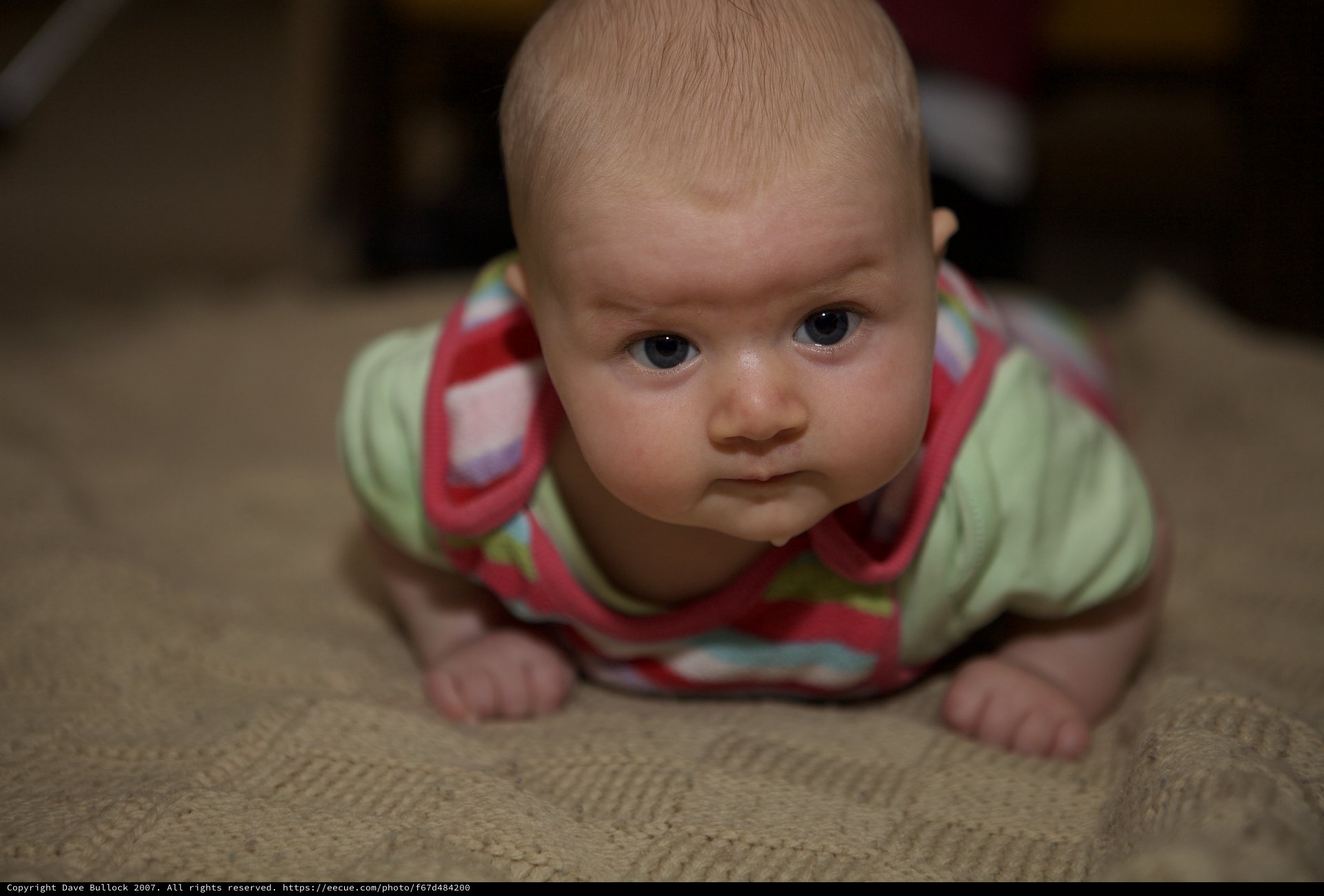 Curious Baby During Tummy Time on Carpet