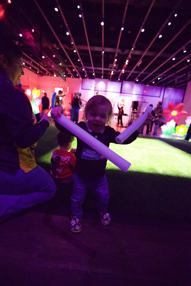 Child with Glow Sticks at Baby Rave Event