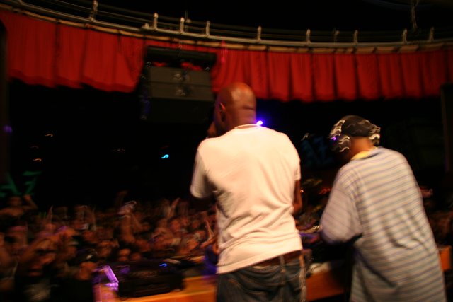 Two Men Performing on Club Stage