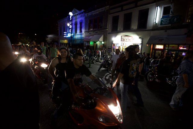 Motorcycles Cruise Through Austin at Night