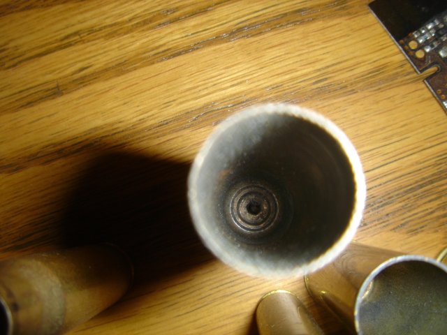 Metal Object on Hardwood Table