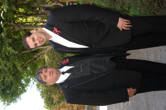Father and Son Pose Together at Wedding Celebration
