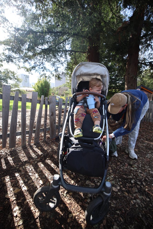 Parent and Child Moment in Park Playground