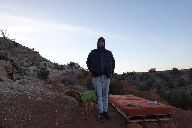 Man and Dog Enjoying the Scenic Outdoors