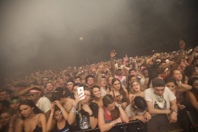 Smoke-filled concert crowd