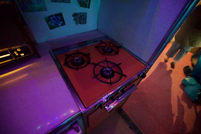 Gas Stove Installation Under Colored Gallery Lighting