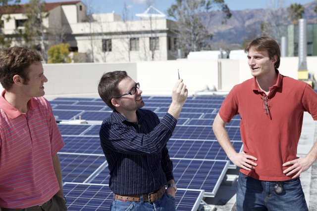 Three Men Harnessing Solar Power