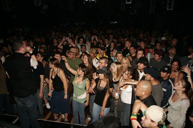 Packed Indoor Concert Crowd at Nightclub Event