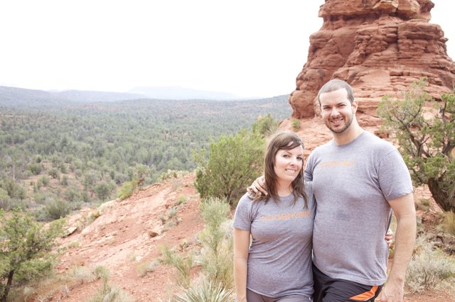 Couple Smiling Atop Sedona Red Rock Overlook