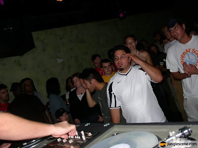 Nightclub DJ Entertains Lively Crowd