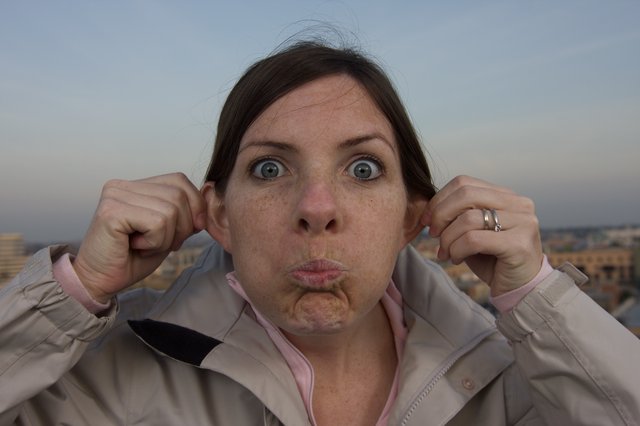 Woman Making a Silly Face on Urban Rooftop