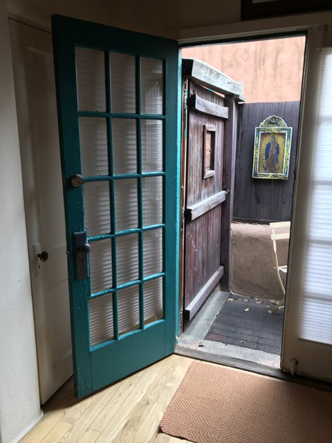 Green Glass and Wooden Door