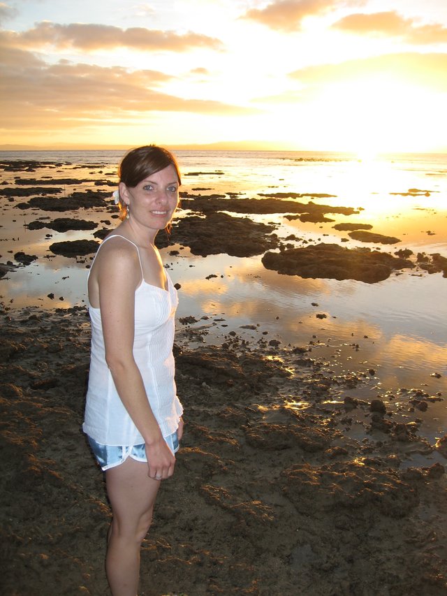 Woman Smiling at Sunset on Fiji Tidal Flats