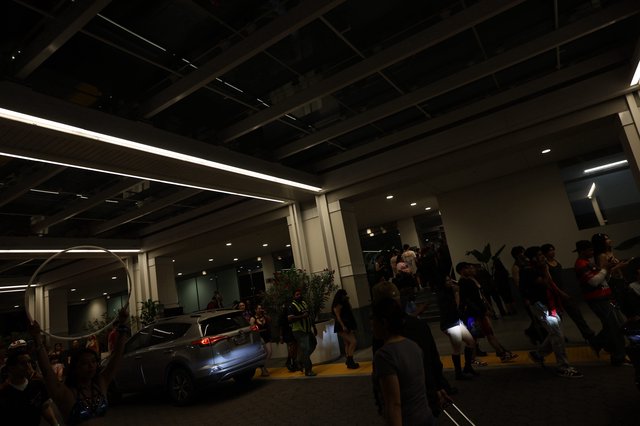 Festival Crowd Gathers Outside Venue at Night
