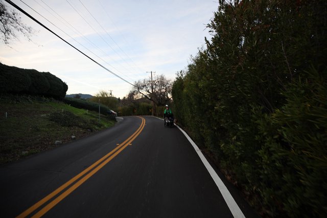 Twilight Cyclist on Rural California Road