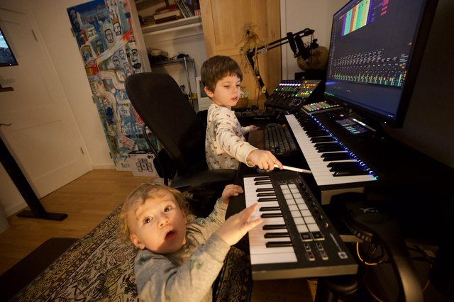 Young Brothers Making Music Together in Home Studio