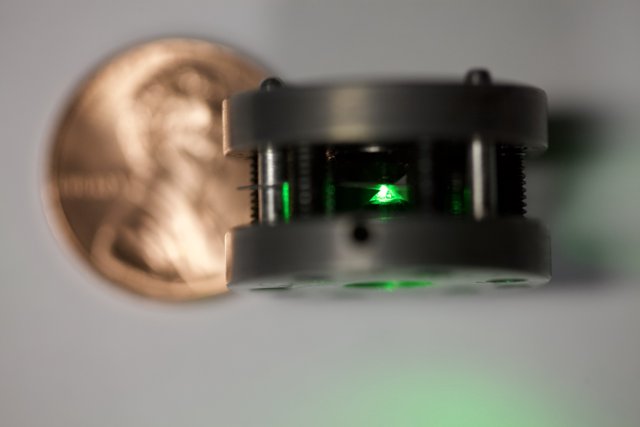 Green Laser Next to a Penny