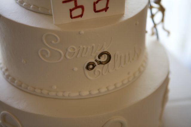Elegant White Wedding Cake with Red and White Design
