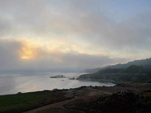 Promontory Overlooking the Foggy Ocean