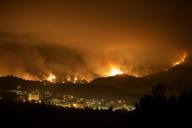 Flames Engulf the Cityscape as Viewed from Atop a Hill During 2009 Station Fire