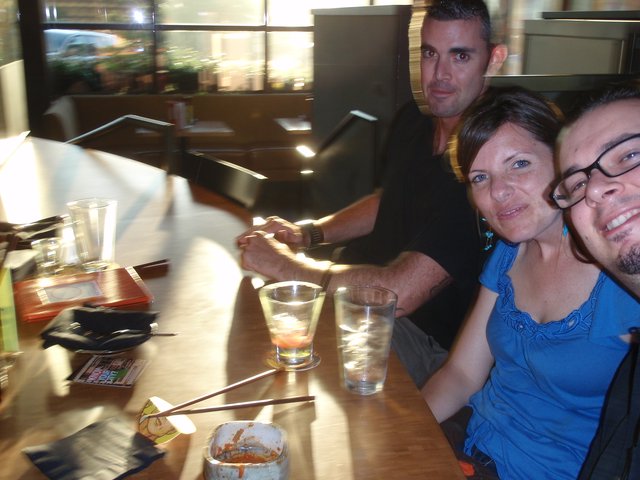 Friends Sharing Drinks at a Japanese Restaurant