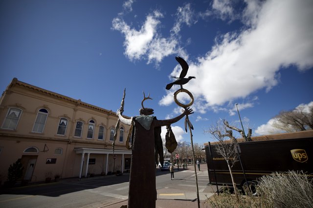 Indigenous Spirit Sculpture Against Santa Fe Sky