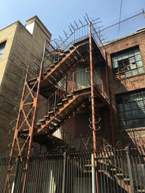 Urban Housing with Metal Staircase and Fence